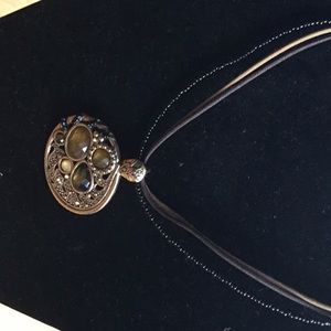 Pendant with gold and green stones